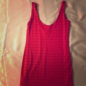 Textured coral dress with turquoise necklace